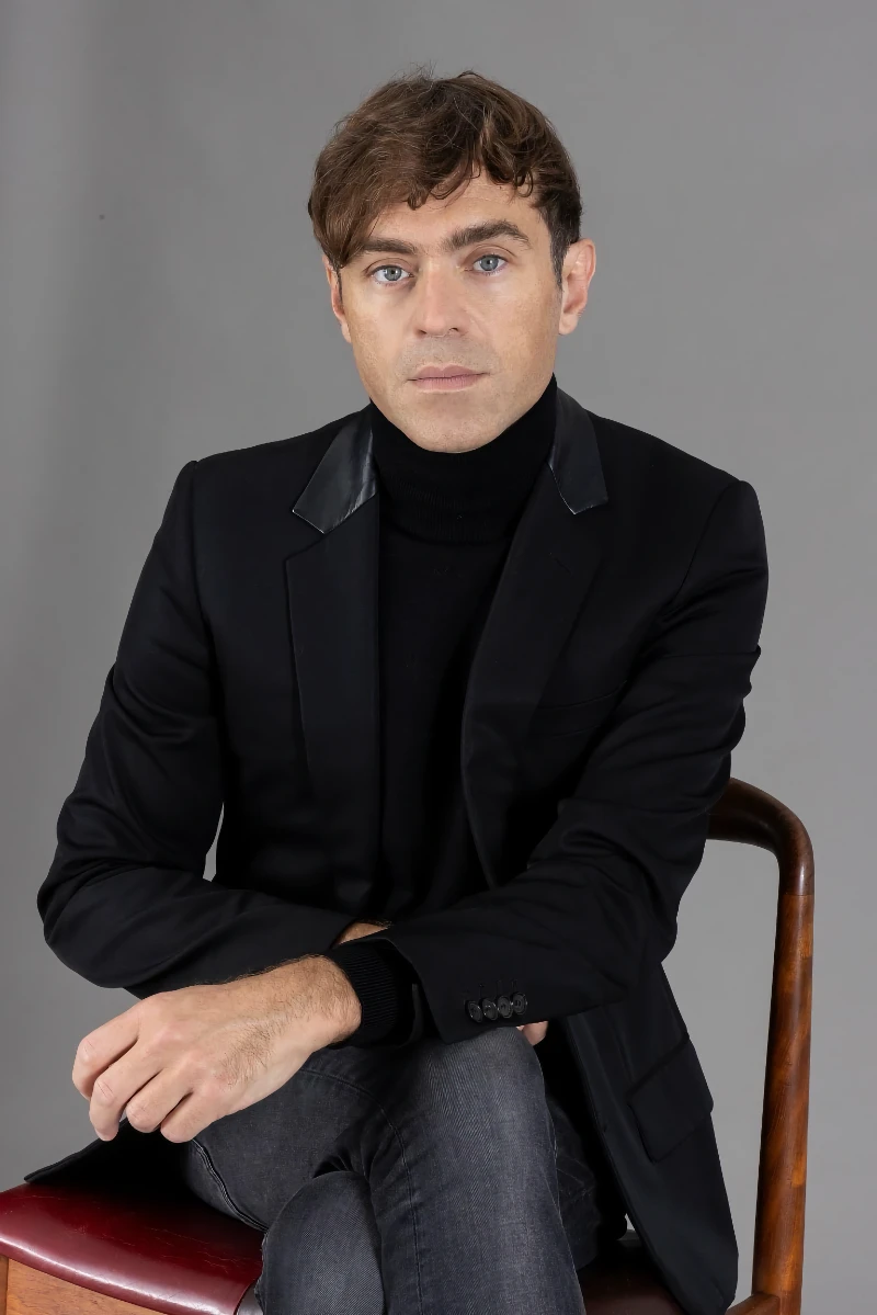 Person wearing jeans and suit